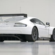 Illustration for article titled An Aston Martin With A Dinner Table Hanging Under Its Rear End Means Business